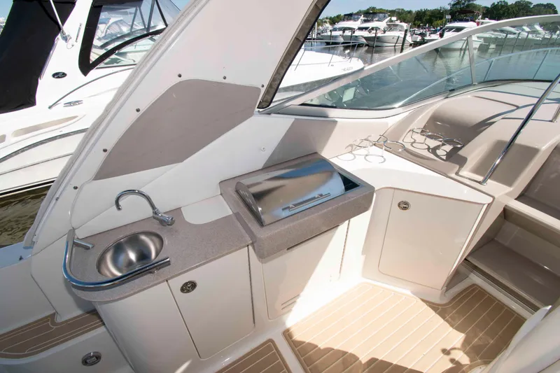 Slide: The Image of 2007 Sea Ray 310 Sundancer boat interior with sink and storage area. - 10
