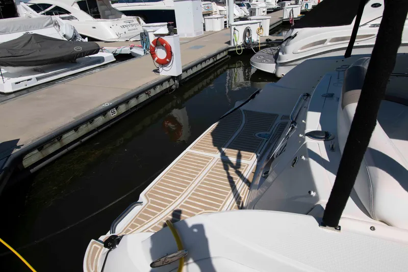 Slide: The Image of 2007 Sea Ray 310 Sundancer docked at marina with swim platform. - 13