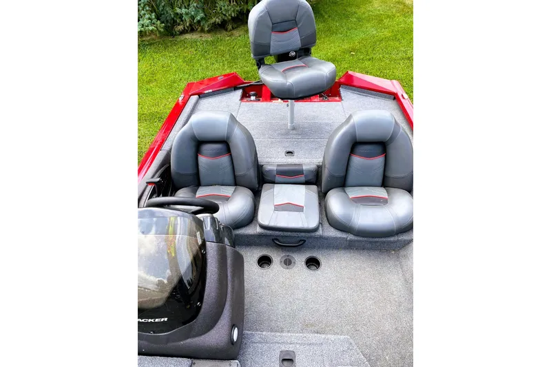 Slide: The Image of 2022 Tracker Pro Team 175 TXW boat interior with gray and red seating. - 3