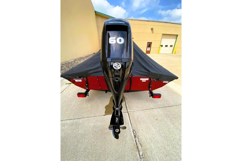 Slide: The Image of 2022 Tracker Pro Team 175 TXW boat with Mercury 60 engine, covered and parked. - 7