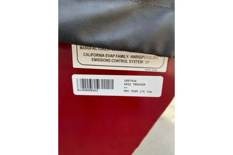 Slide: The Image of Label on 2022 Tracker Pro Team 175 TXW boat, showing model and emissions details. - 9
