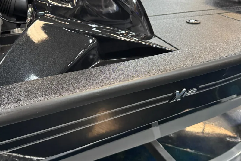 Slide: The Image of 2025 Xpress X19 Pro boat, sleek black design with logo detail. - 10