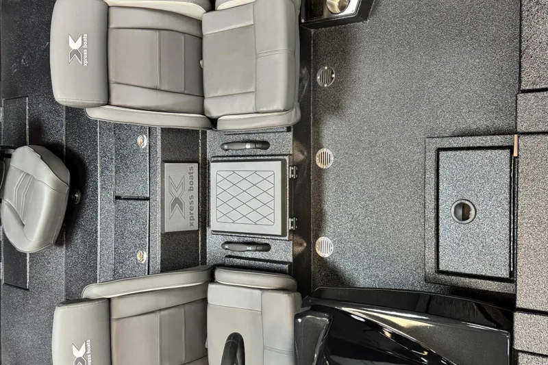 Slide: The Image of Interior of 2025 Xpress X19 Pro boat with gray seating and sleek design. - 5