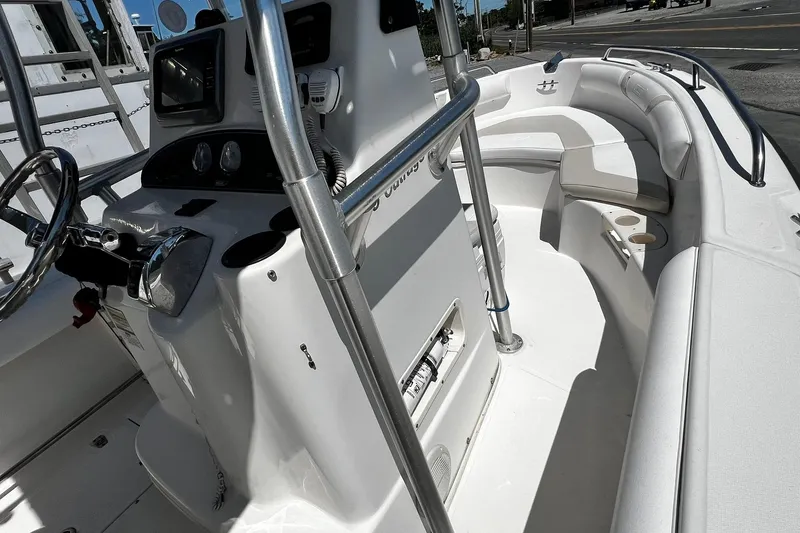 Slide: The Image of 2006 Boston Whaler 210 Outrage boat interior with steering console and seating area. - 10