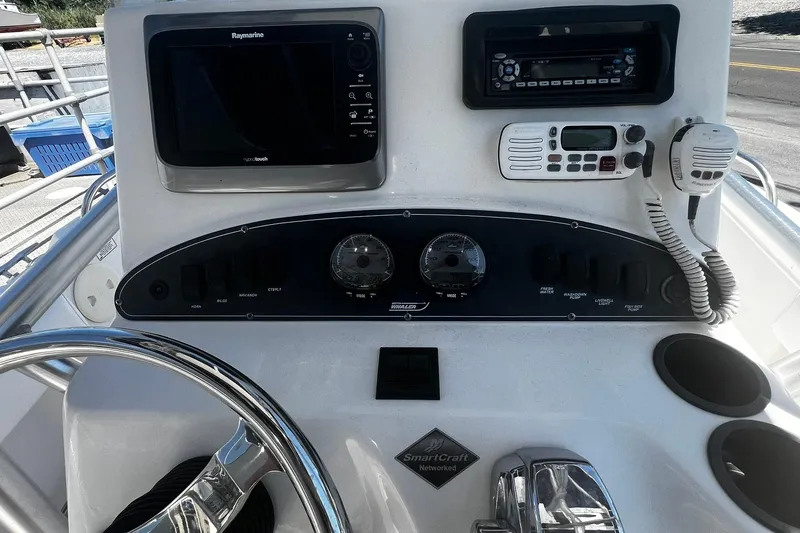Slide: The Image of Control panel of a 2006 Boston Whaler 210 Outrage boat with navigation equipment. - 15