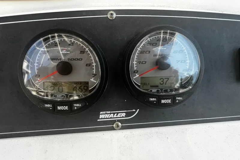 Slide: The Image of Dashboard of a 2006 Boston Whaler 210 Outrage showing RPM and speed gauges. - 16