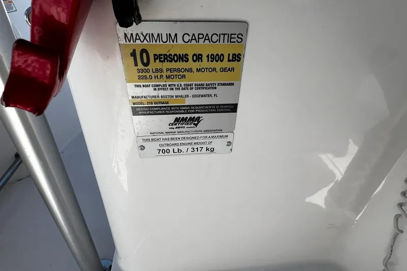 Slide: The Image of Capacity label on 2006 Boston Whaler 210 Outrage, maximum 10 persons or 1900 lbs. - 21