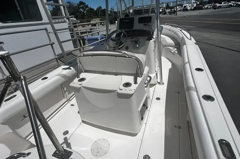 Slide: The Image of 2006 Boston Whaler 210 Outrage boat interior with steering console and seating. - 3