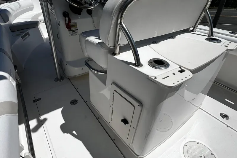 Slide: The Image of 2006 Boston Whaler 210 Outrage boat interior with seating and console details. - 7