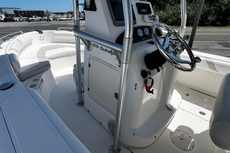 Slide: The Image of 2006 Boston Whaler 210 Outrage boat interior with steering console and seating. - 8