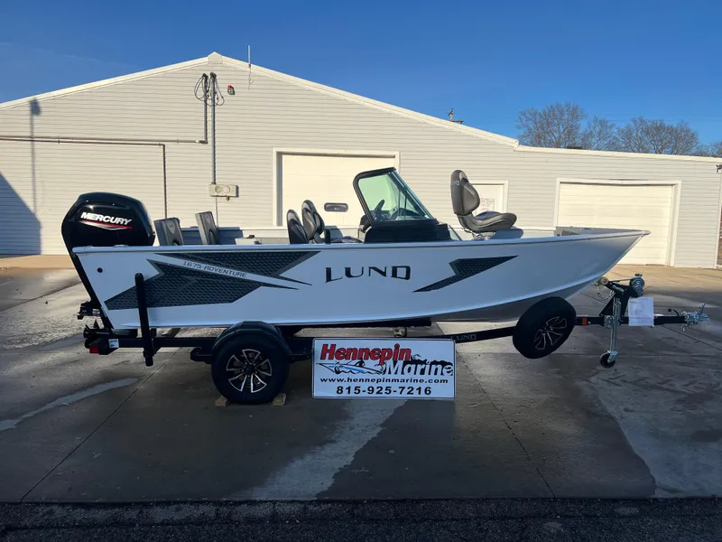 The Image of 2026 Lund 1675 Adventure Sport boat on trailer at Hennepin Marine dealership. - 0