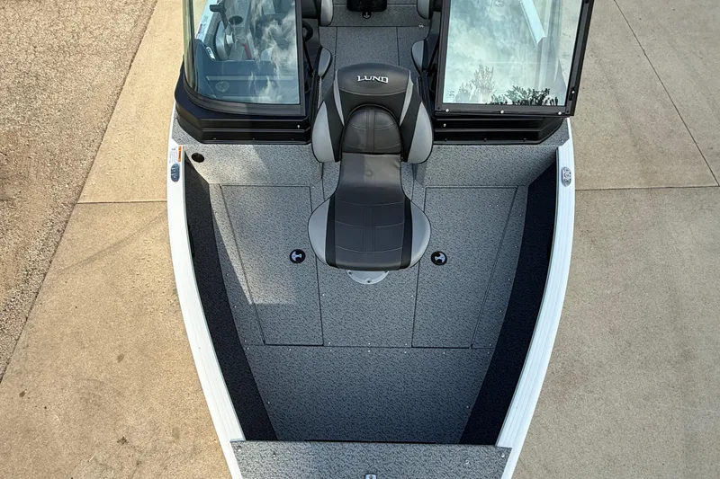 Slide: The Image of 2026 Lund 1675 Adventure Sport boat interior with seating and windshield. - 13