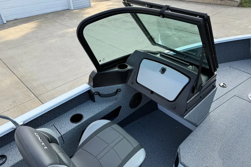 Slide: The Image of 2026 Lund 1675 Adventure Sport boat interior with windshield and seating. - 20