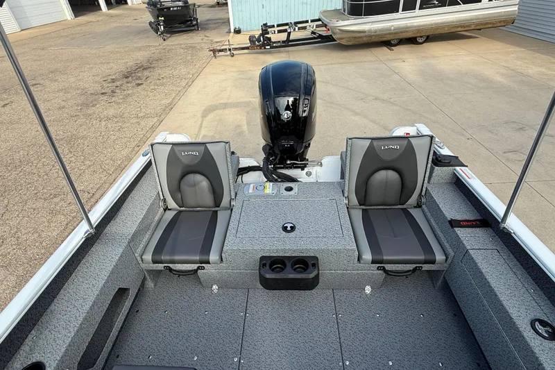 Slide: The Image of 2026 Lund 1675 Adventure Sport boat interior with dual seats and motor. - 24