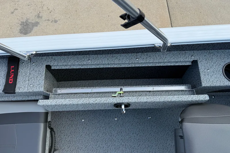 Slide: The Image of 2026 Lund 1675 Adventure Sport boat interior with storage compartment and seating. - 25