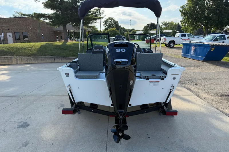 Slide: The Image of 2026 Lund 1675 Adventure Sport boat with Mercury 90 engine, parked outdoors. - 6