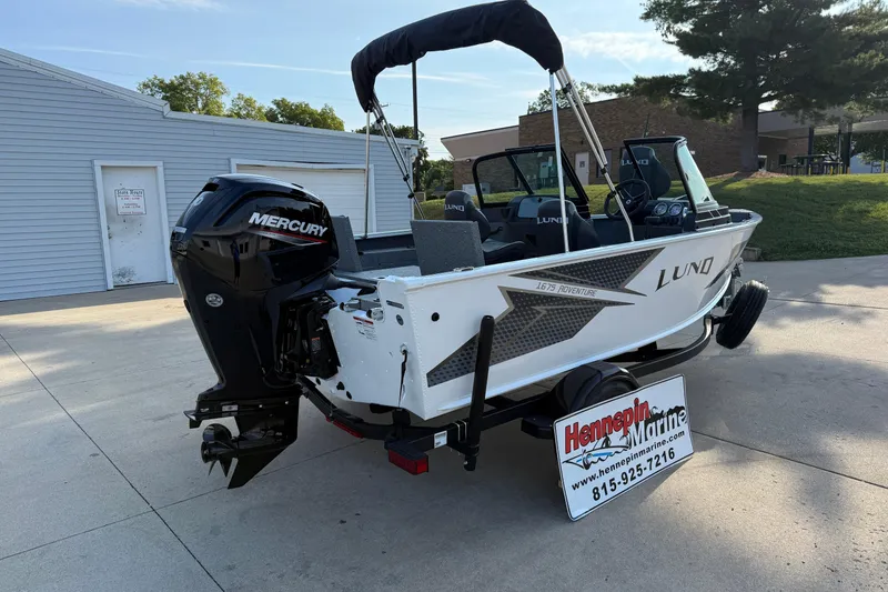 Slide: The Image of 2026 Lund 1675 Adventure Sport boat with Mercury engine, displayed at Hennepin Marine dealership. - 7