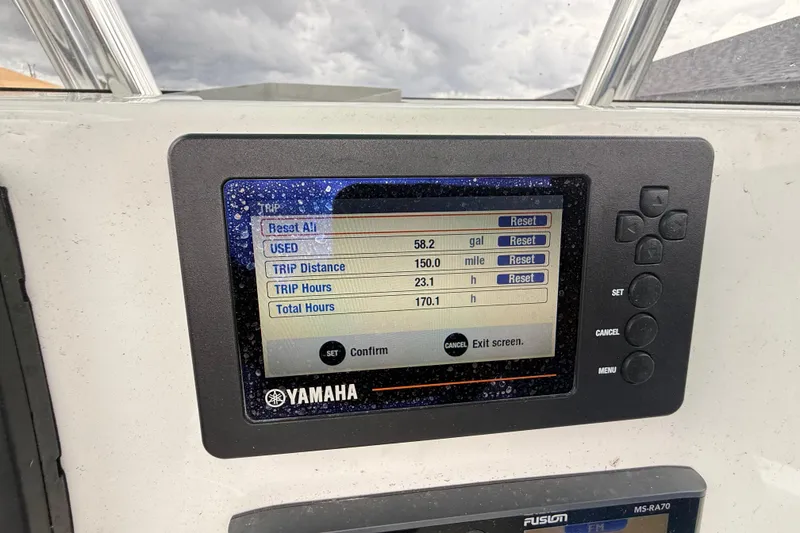 Slide: The Image of Yamaha boat display showing trip data: 58.2 gallons used, 150 miles traveled, 23.1 trip hours. - 13