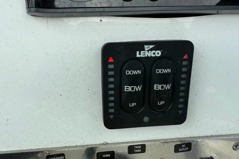 Slide: The Image of Lenco trim tab control panel on 2018 Release 208 RX boat. - 16