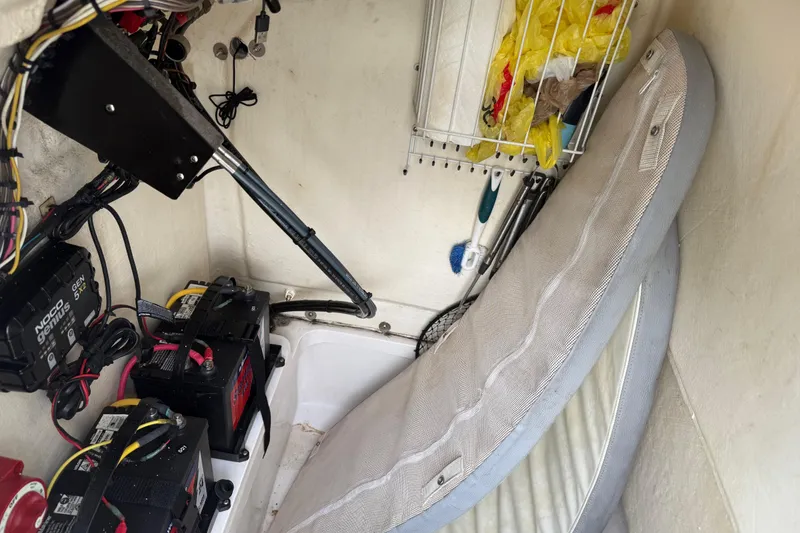 Slide: The Image of Interior of 2018 Release 208 RX boat showing batteries, wiring, and storage area. - 20