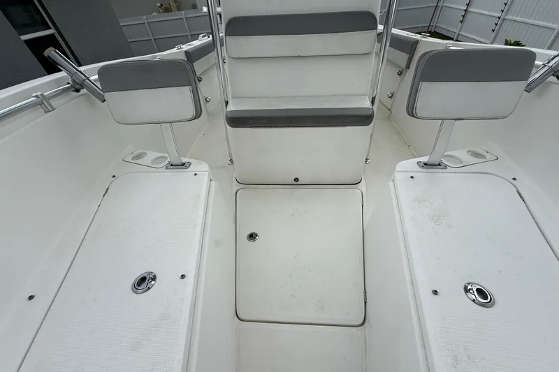 Slide: The Image of Interior of 2018 Release 208 RX boat with seating and storage compartments. - 23