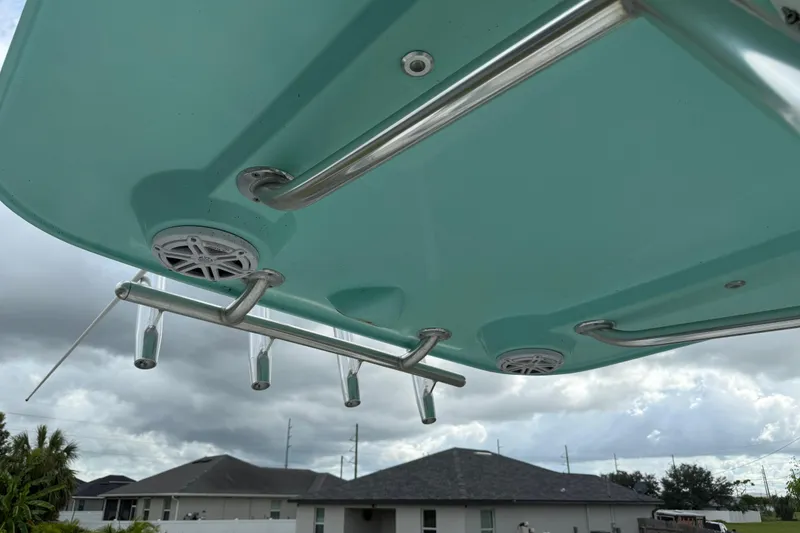 Slide: The Image of Underside view of 2018 Release 208 RX boat canopy with rod holders and speakers. - 24