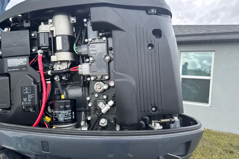 Slide: The Image of Close-up of a 2018 Release 208 RX engine with visible components and wiring. - 8