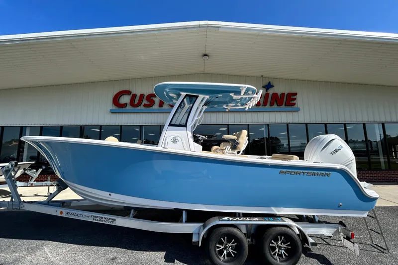 The Image of 2026 Sportsman Open 232 Center Console boat on trailer outside Custom Marine. - 0