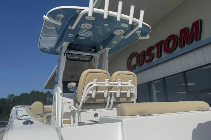 Slide: The Image of 2026 Sportsman Open 232 Center Console boat at a custom dealership. - 14