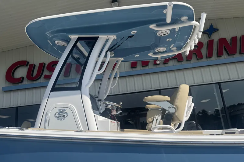 Slide: The Image of 2026 Sportsman Open 232 Center Console boat at Custom Marine dealership. - 17