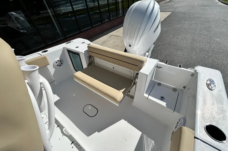 Slide: The Image of 2026 Sportsman Open 232 Center Console boat interior with seating and storage. - 22