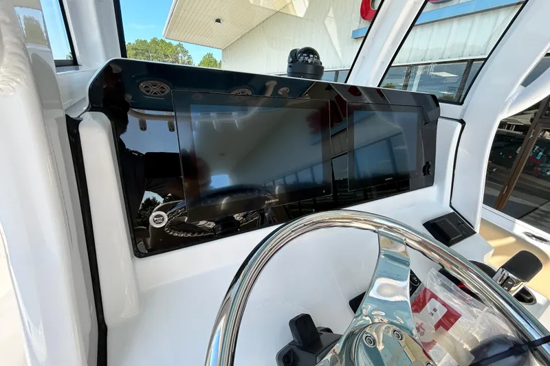 Slide: The Image of 2026 Sportsman Open 232 Center Console dashboard with modern navigation display. - 27
