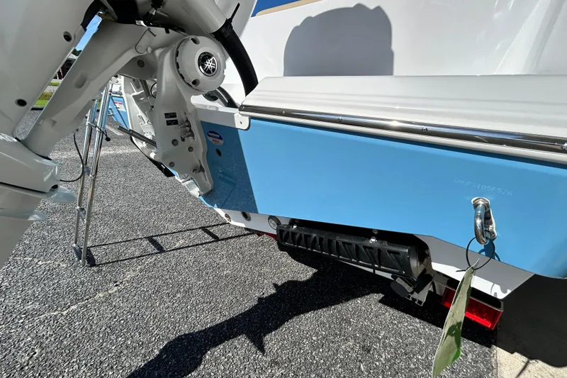 Slide: The Image of 2026 Sportsman Open 232 Center Console boat, rear view with motor and ladder. - 4