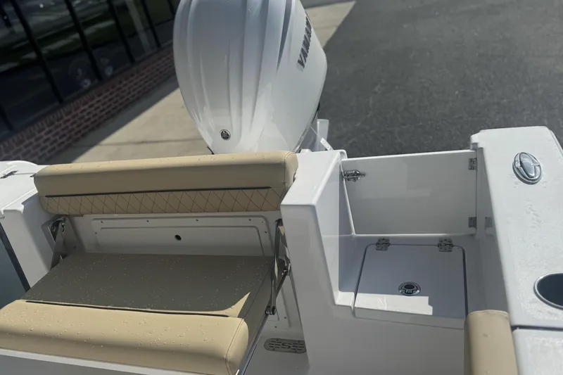 Slide: The Image of 2026 Sportsman Open 232 Center Console boat with beige seating and Yamaha engine. - 5