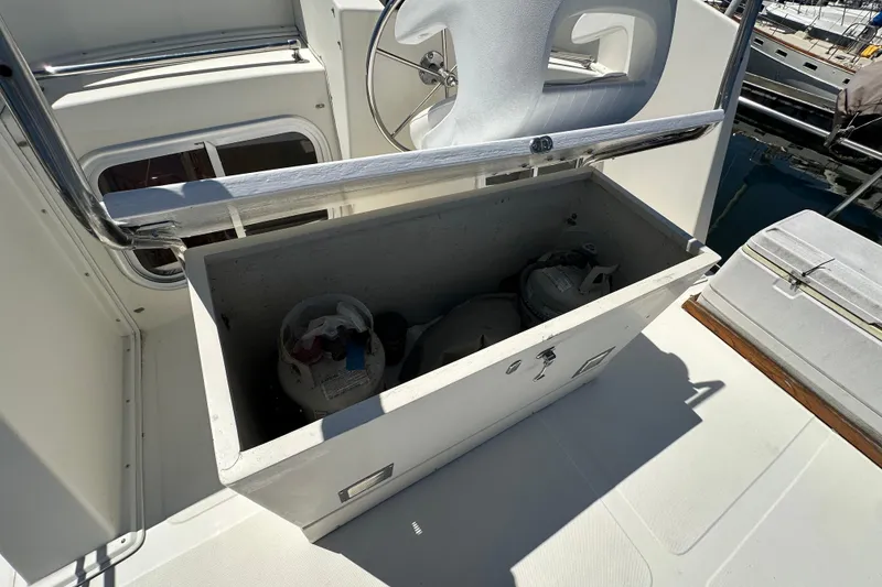 Slide: The Image of Open storage compartment on 2000 Eagle 40 Pilothouse Trawler, containing propane tanks. - 10
