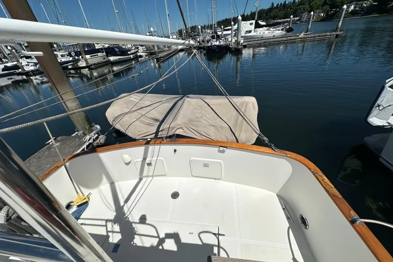 Slide: The Image of Eagle 40 Pilothouse Trawler 2000 docked at marina, view of deck and water. - 12