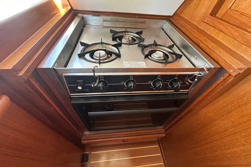 Slide: The Image of Stainless steel stove with two burners in 2000 Eagle 40 Pilothouse Trawler kitchen. - 22