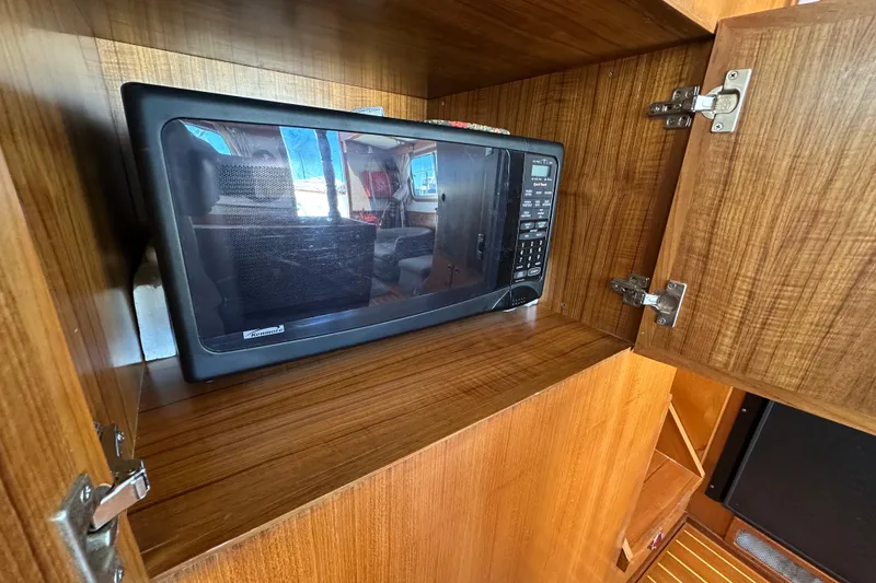 Slide: The Image of Microwave in wooden cabinet on 2000 Eagle 40 Pilothouse Trawler. - 23
