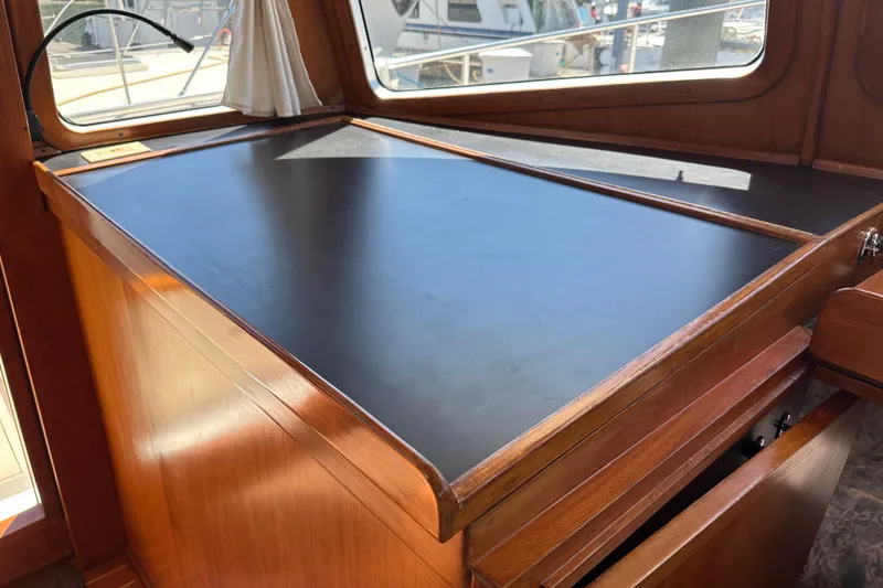 Slide: The Image of Interior view of 2000 Eagle 40 Pilothouse Trawler's navigation desk area. - 32