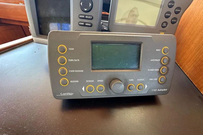 Slide: The Image of ComNav autopilot system on 2000 Eagle 40 Pilothouse Trawler dashboard. - 41