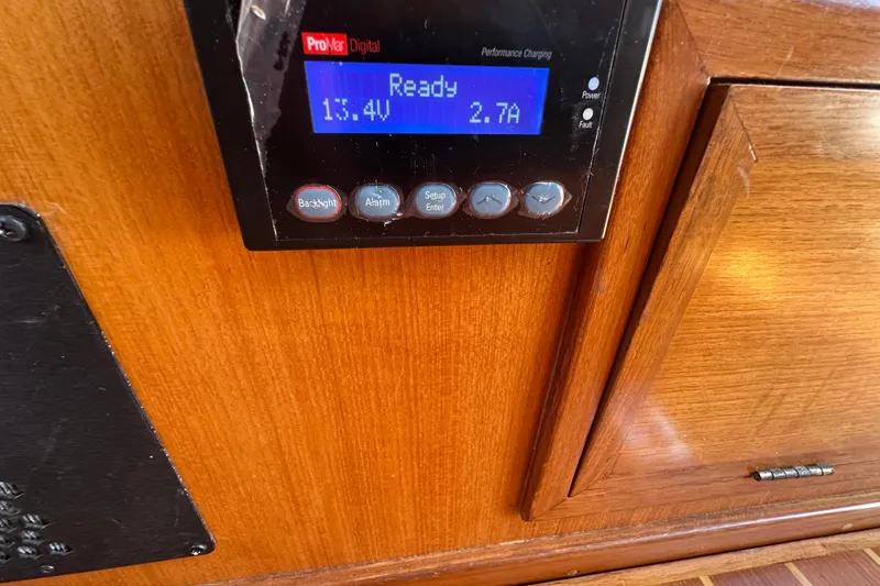 Slide: The Image of Control panel on 2000 Eagle 40 Pilothouse Trawler displaying voltage and current. - 43