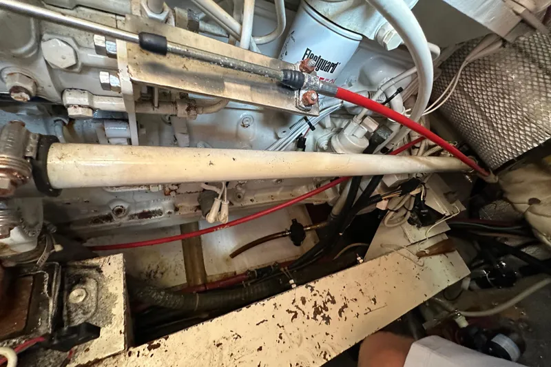 Slide: The Image of Engine room of a 2000 Eagle 40 Pilothouse Trawler with visible components and wiring. - 66