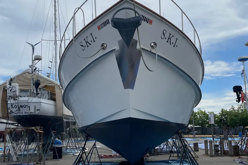 Slide: The Image of Eagle 40 Pilothouse Trawler 2000 in dry dock, front view with clear sky. - 74