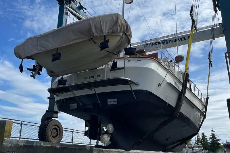 Slide: The Image of Eagle 40 Pilothouse Trawler 2000 in dry dock, Olympia, WA, under blue sky. - 77