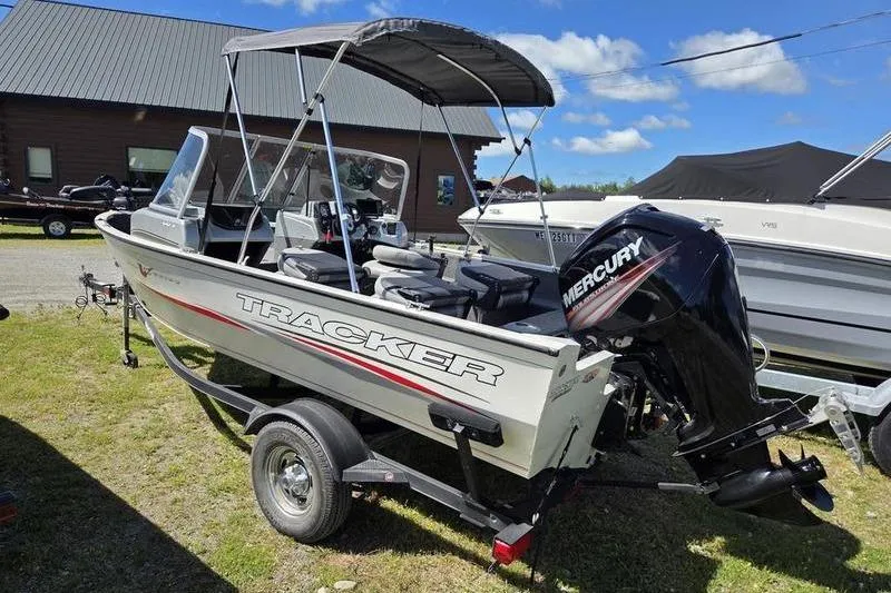 Slide: The Image of 2018 Tracker PG V16 WT boat with Mercury outboard motor on trailer. - 7