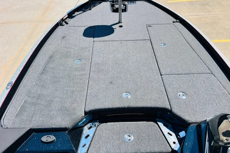 Slide: The Image of 2024 Ranger Z521R Ranger Cup Equipped boat deck with gray carpet and storage compartments. - 14