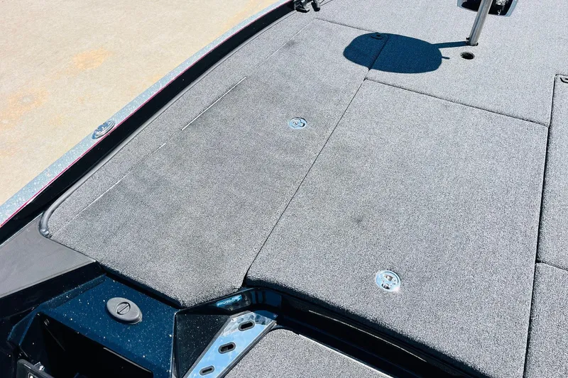 Slide: The Image of 2024 Ranger Z521R Ranger Cup Equipped boat deck with carpeted surface and storage compartments. - 15