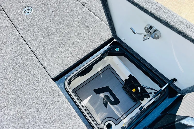 Slide: The Image of 2024 Ranger Z521R Ranger Cup Equipped storage compartment with open lid and visible interior. - 24