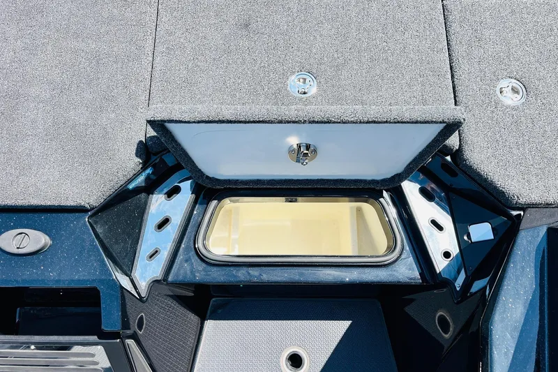 Slide: The Image of 2024 Ranger Z521R Ranger Cup Equipped boat storage compartment, open lid, and sleek design. - 27