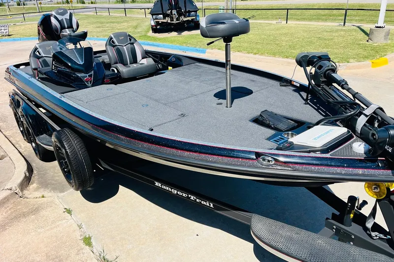Slide: The Image of 2024 Ranger Z521R Ranger Cup Equipped boat on trailer, parked outdoors. - 3